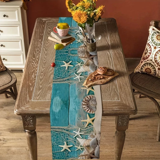 Wooden table with a Coastal table runner featuring sea-themed design, surrounded by chairs.