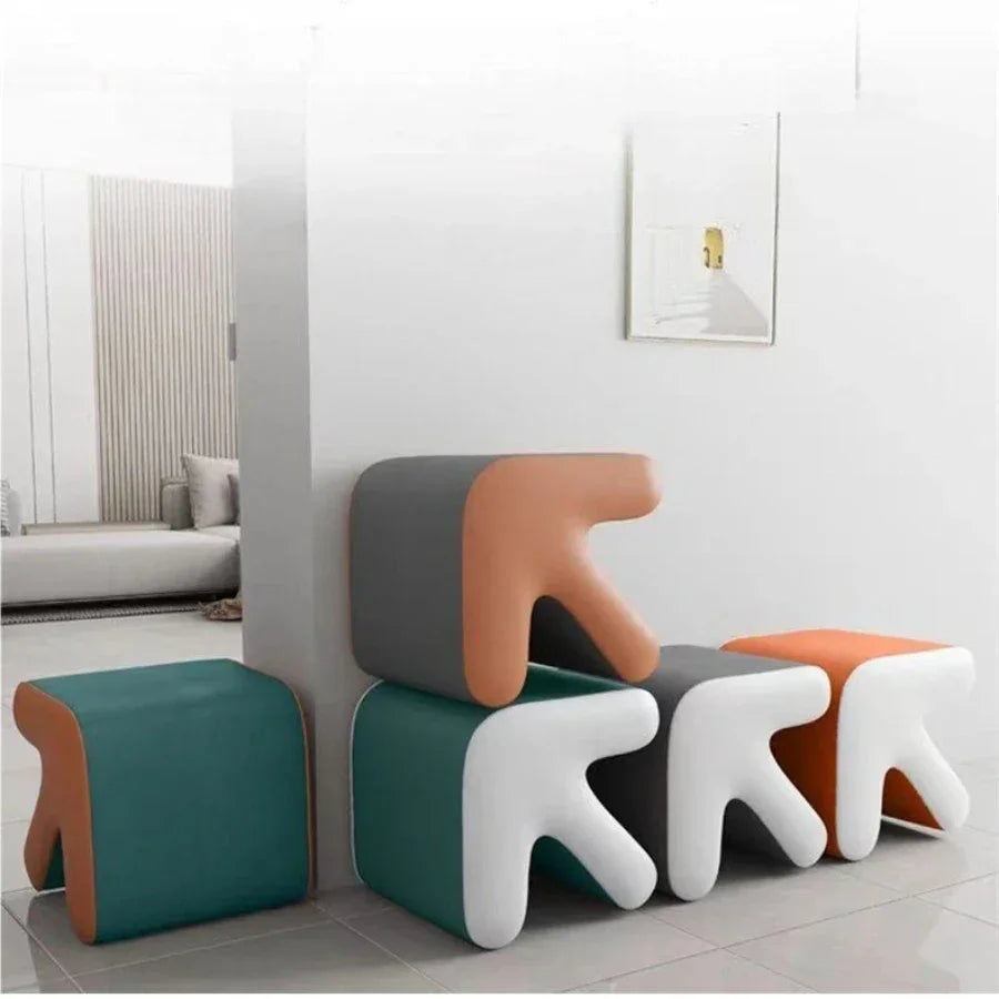 Modern colorful stools in a minimalistic room setting