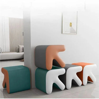 Modern colorful stools in a minimalistic room setting