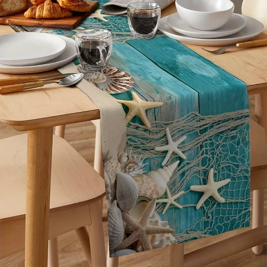 Table setting with a decorative table runner featuring starfish and shells on a wooden table.