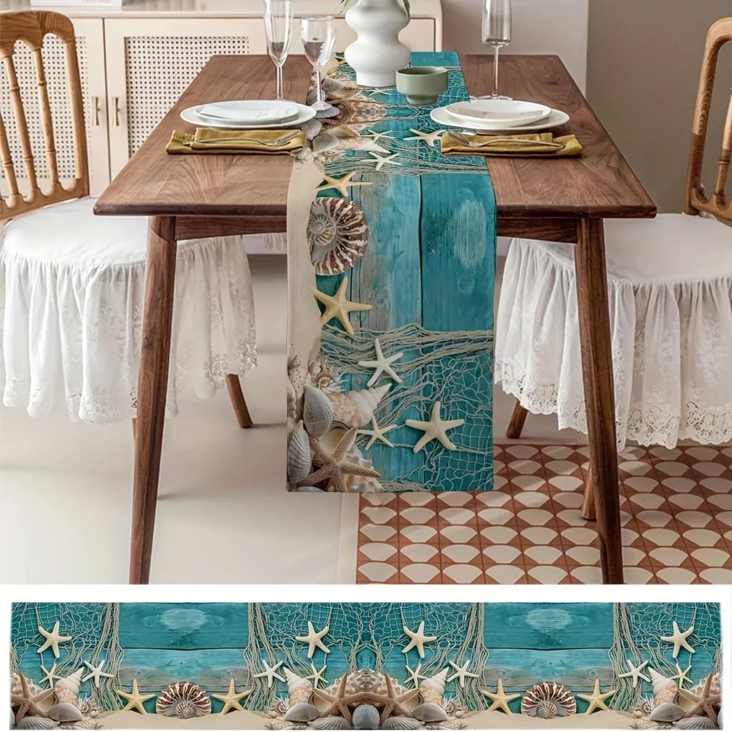 Dining table with a decorative table runner featuring starfish and seashells in a coastal theme.