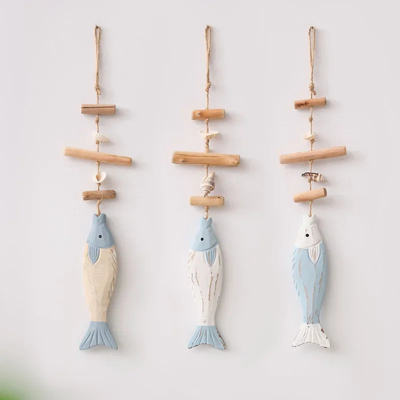 Three hanging fish decorations on a white background