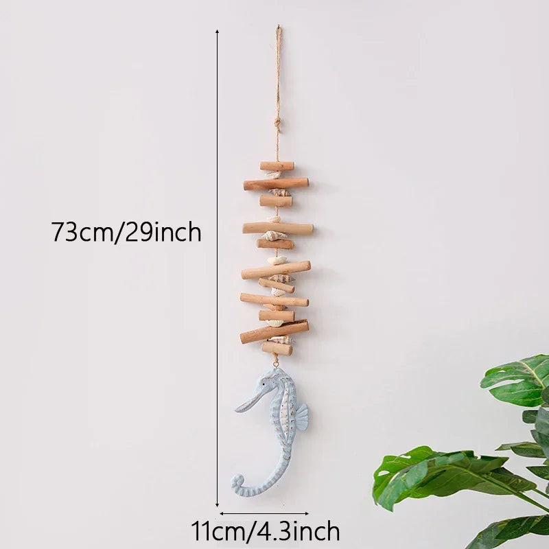 Decorative hanging with seahorse and wooden sticks, shown with measurements against a white background.