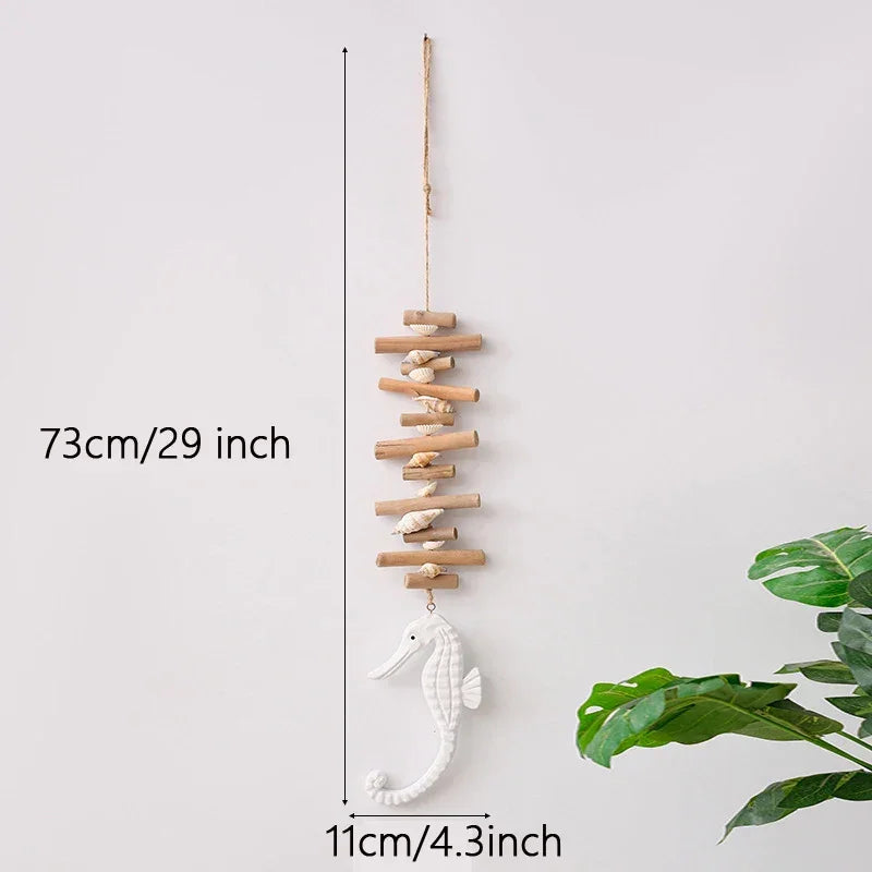 Decorative wall hanging with seahorse and wooden sticks, measurement details on a white background.