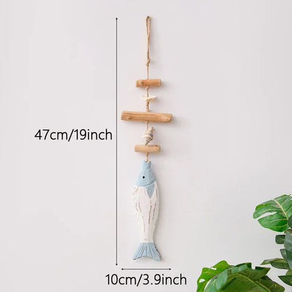 Decorative fish ornament with measurement details on a white background