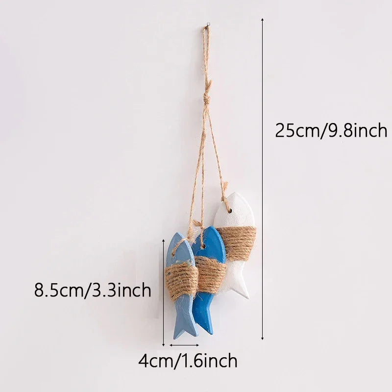 Decorative fish-shaped hanging ornament with measurements on a white background