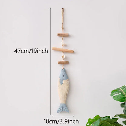 Decorative fish-shaped hanging ornament with measurements on a light gray background