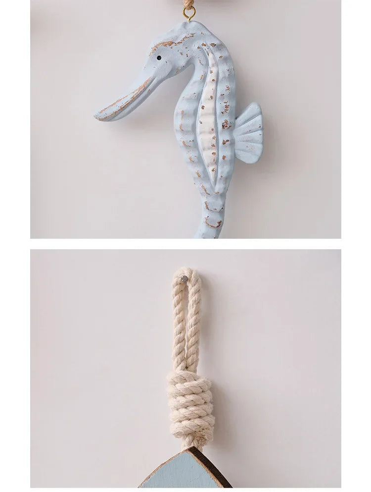 Decorative seahorse hanging on a rope against a light background