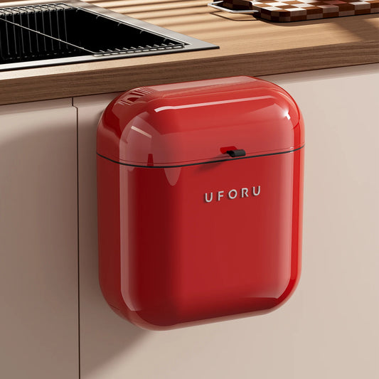 Red kitchen Waste Bin on a kitchen cabinet