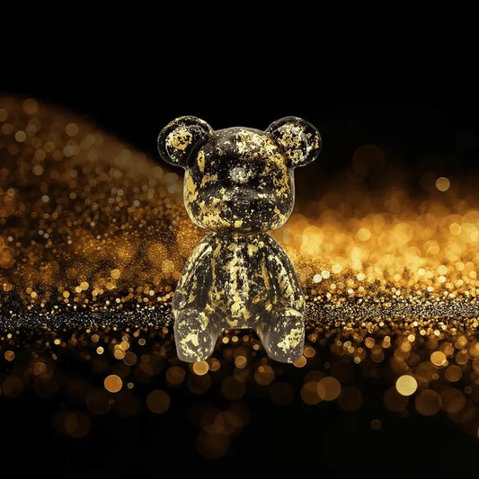 Gold teddy bear on a glittery black and gold background