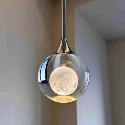 Modern Art Moon Pendant with glass shade and metallic fixture