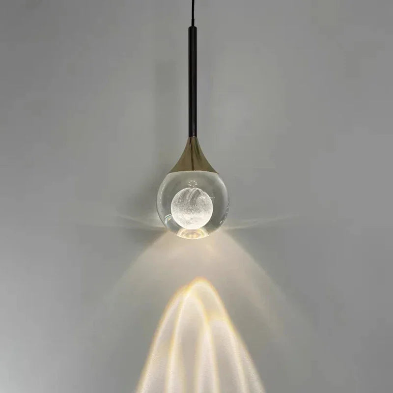 Modern Art Moon Pendant with a glass shade on a gray background