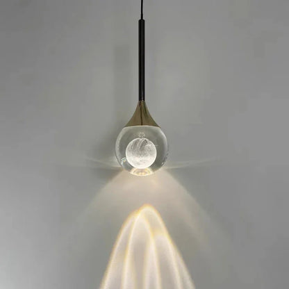 Modern Art Moon Pendant with a glass shade on a gray background