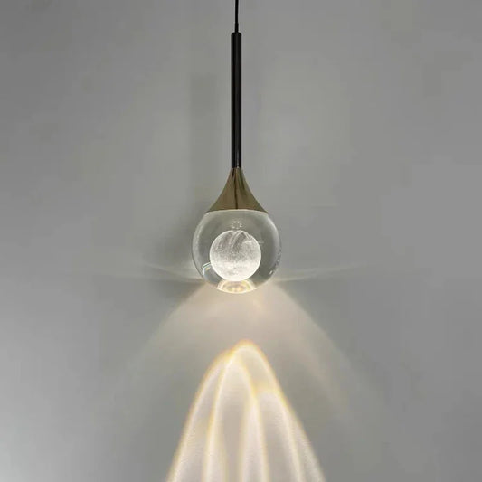 Modern Art Moon Pendant with a glass shade on a gray background