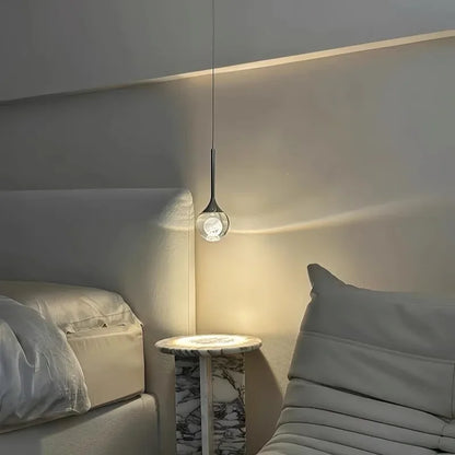 Modern interior with a Modern Art Moon Pendant, sofa, and side table.