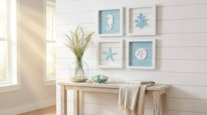 Nautical-themed wall art with seahorse, starfish, and coral decorations on a white wall.