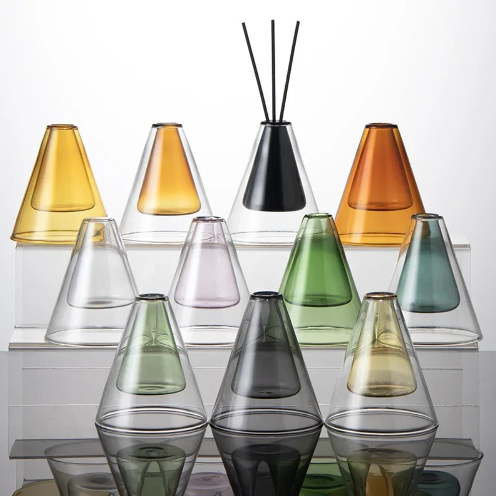 Set of colorful Triangle Glass Aromatherapy Vase on a white background