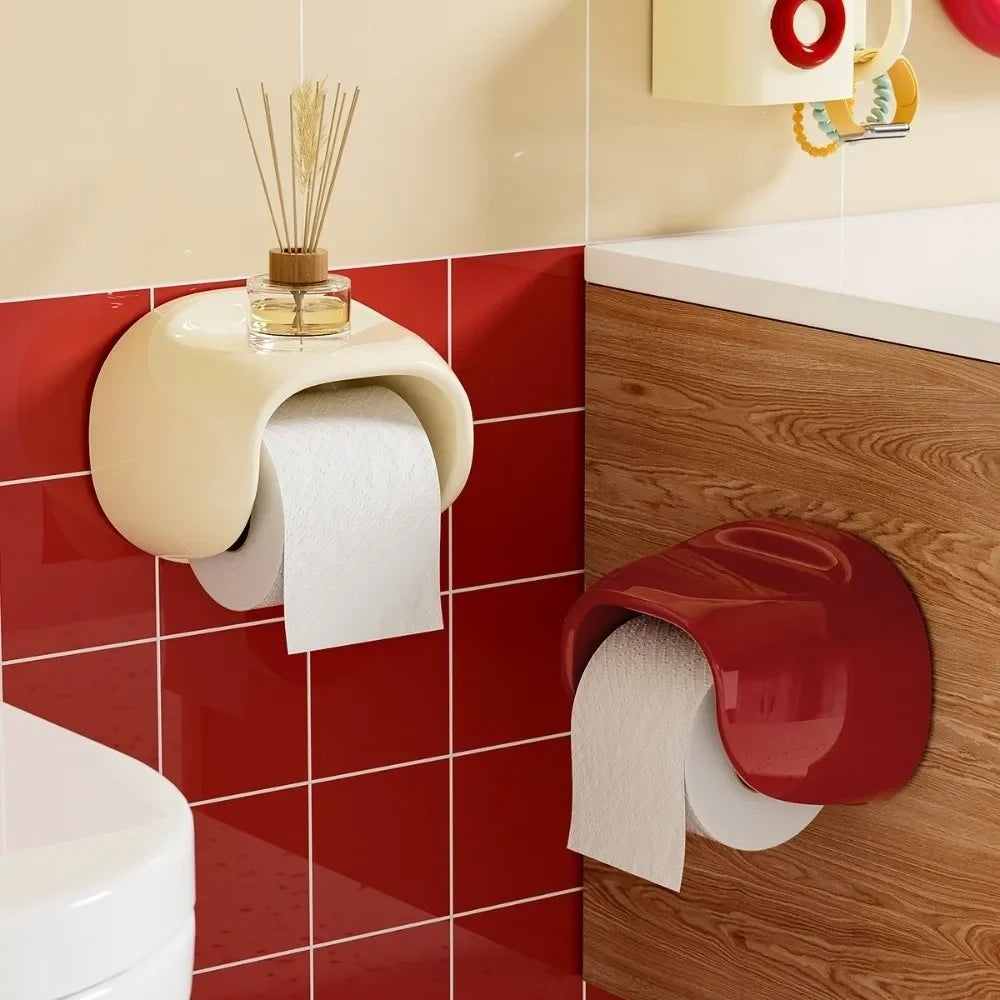 Two Vintage Roll Holder on a bathroom wall with red tiles and wooden panel.