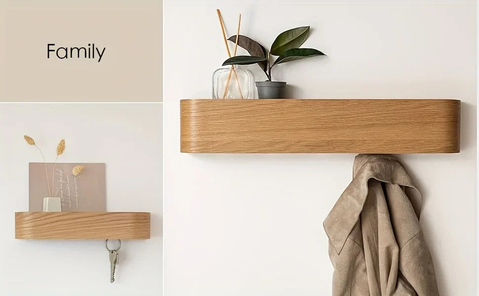 Wooden shelf on a white wall with decorative items including a plant and a framed picture.